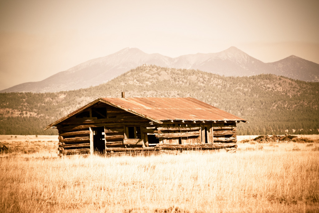 Old Ranch Cabin with peaks in the background