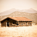 Old Ranch Cabin with peaks in the background
